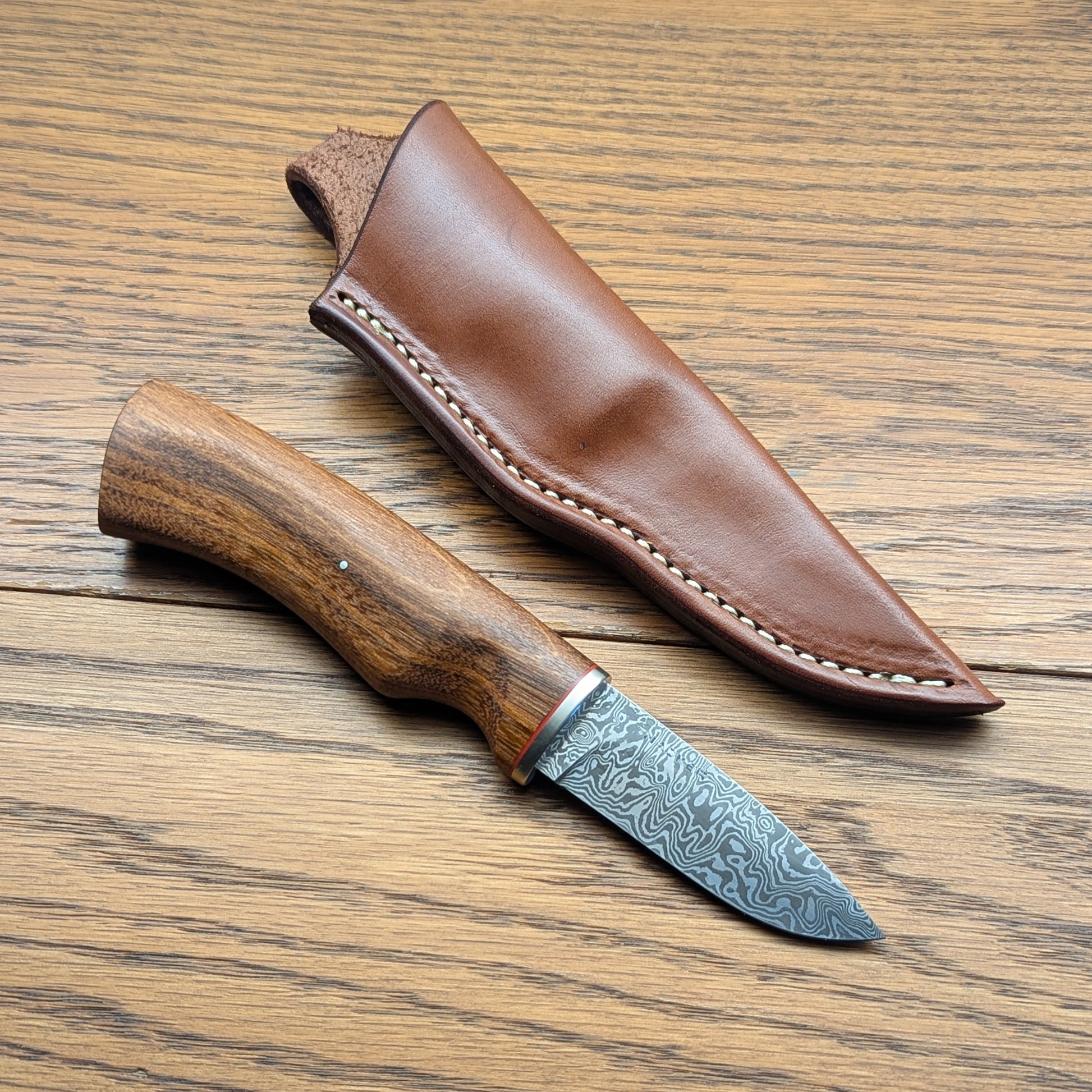 Custom handmade knife with brown leather sheath