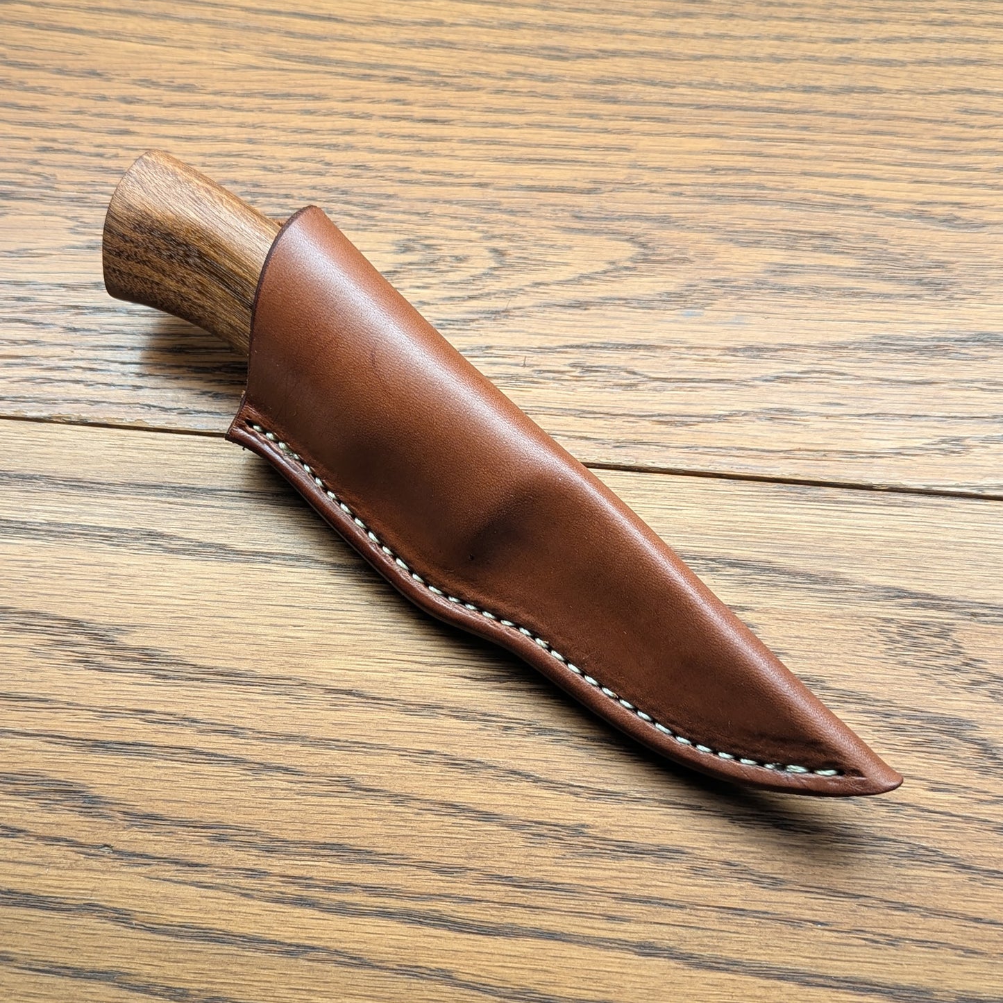 Custom Damascus knife in handmade sheath
