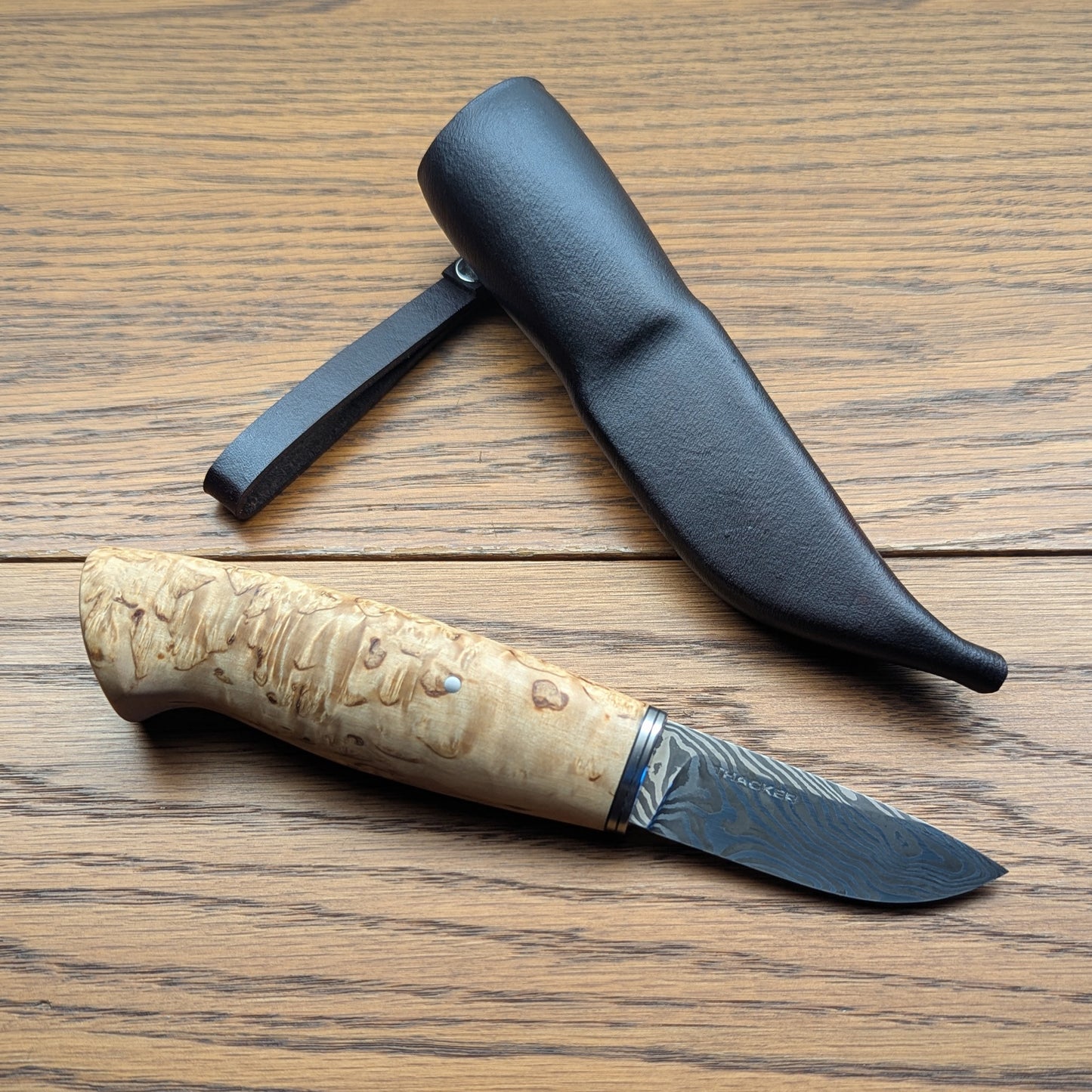 Handmade Puukko knife with Damascus blade and leather sheath